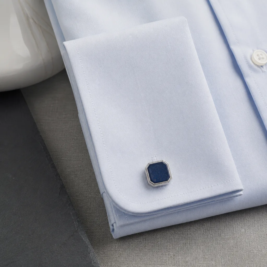 close-up of a folded shirt cuff with a cufflink